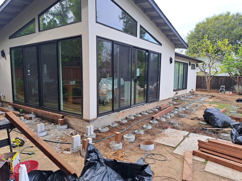 Concrete footings with post bases set along the house, Los Altos