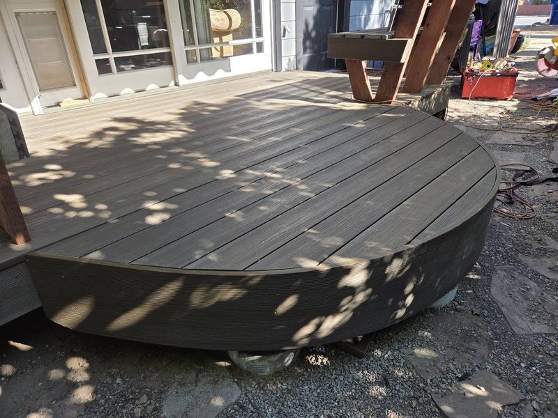 Curved composite deck a step above the gravel, Saratoga
