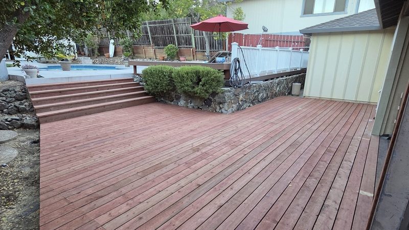 Pressure-treated deck close to grade by the pool, Redwood City