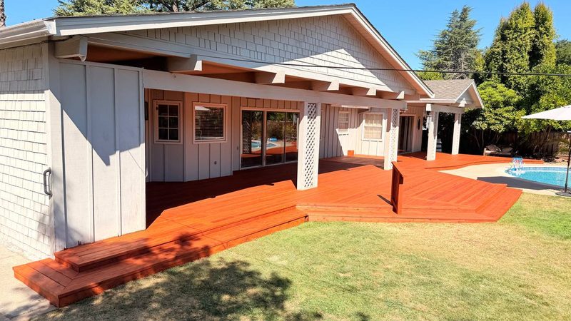 Redwood deck one step above the lawn, no railing, Los Altos