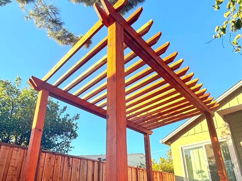 Custom redwood pergola, open rafters, by MS Construction and Services