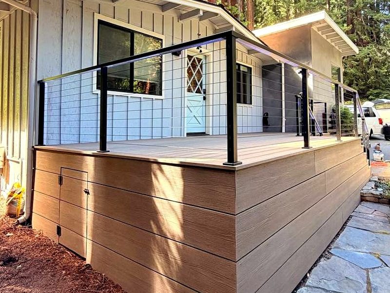 Aluminum cable railing with LED lighting inside the rail, on a composite deck, built by MS Construction and Services