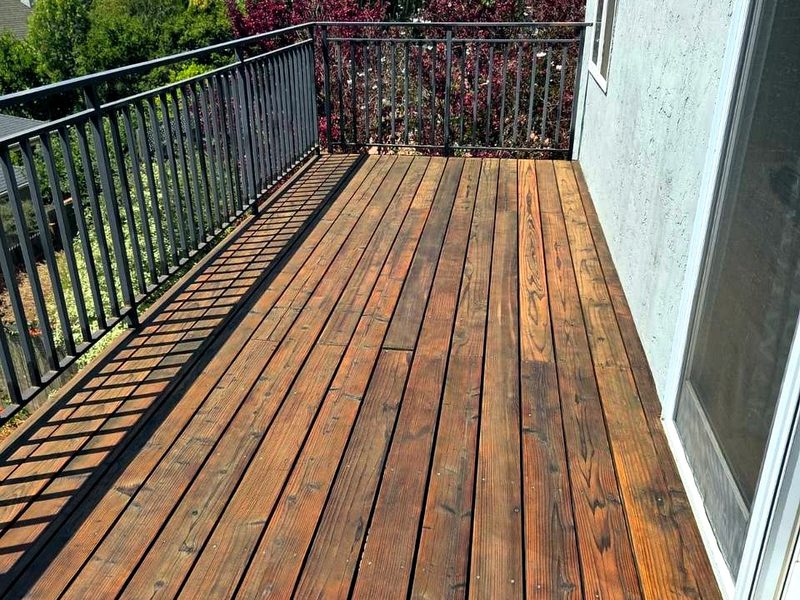 Cedar-tone stain along the railing, by MS Construction and Services