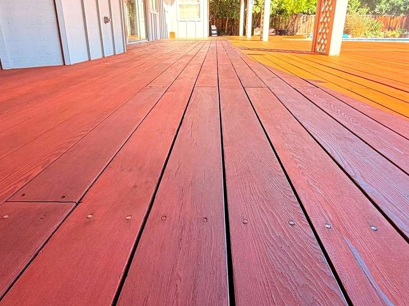 Redwood-tone stain on a redwood deck, by MS Construction and Services