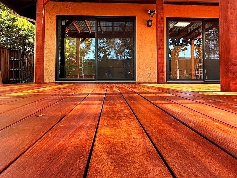 Cumaru hardwood deck under a pergola, built by MS Construction and Services