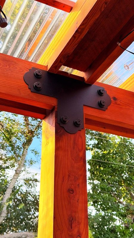 Steel bracket detail on the redwood post