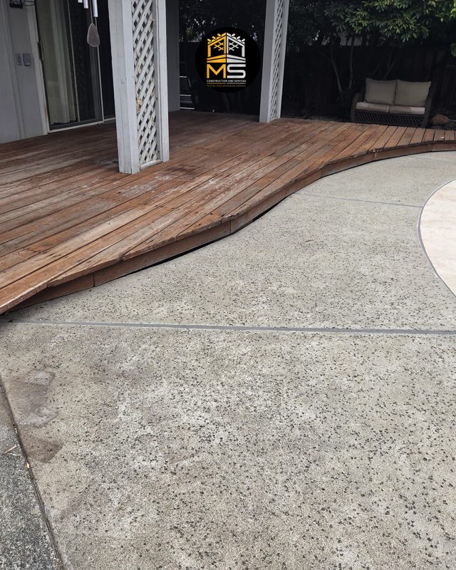 Old boards meeting the pool concrete