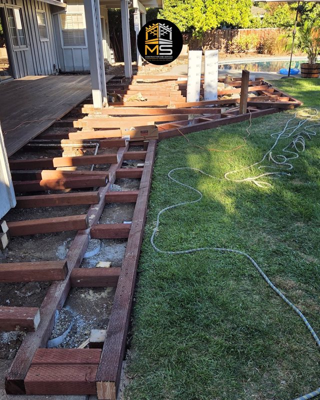 Existing joists exposed along the house