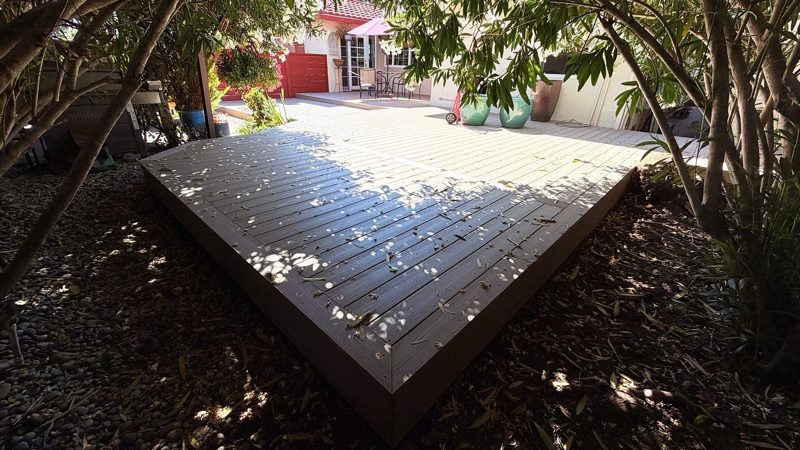Corner of the deck under the trees