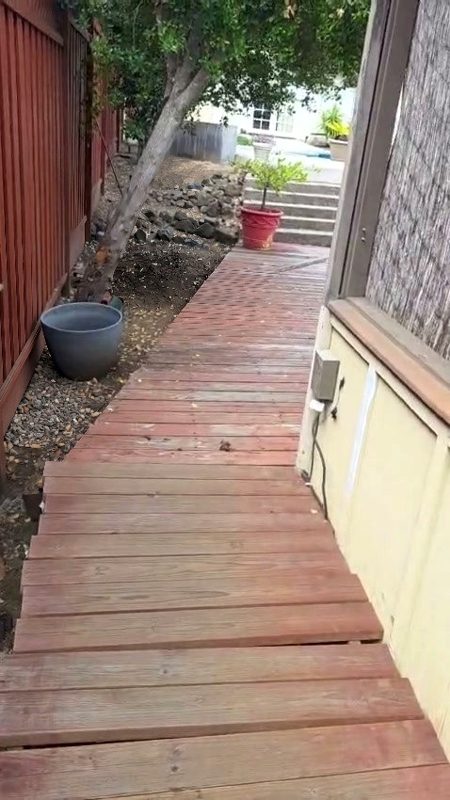 Worn boards along the house