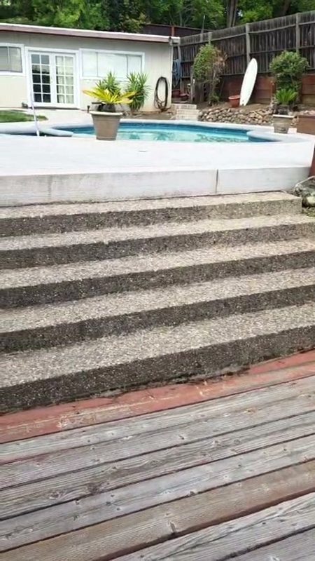 Bare concrete pool steps