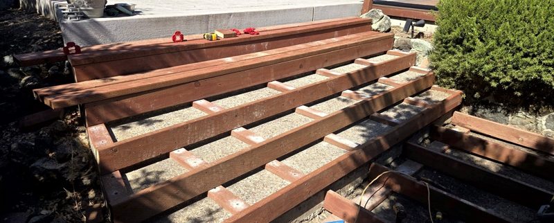 Pool steps getting clad in wood