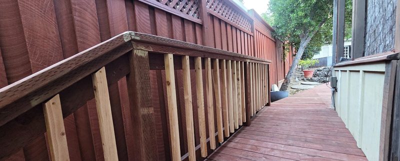 Wood railing with a redwood top rail