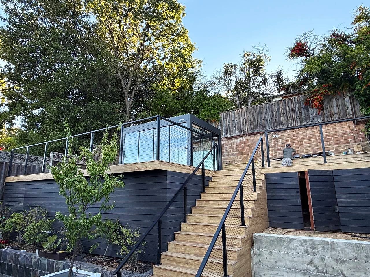 San Carlos — Hillside deck with cable railing and a glass-wall pergola