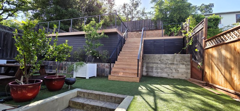 Yard view: stairs up to the deck