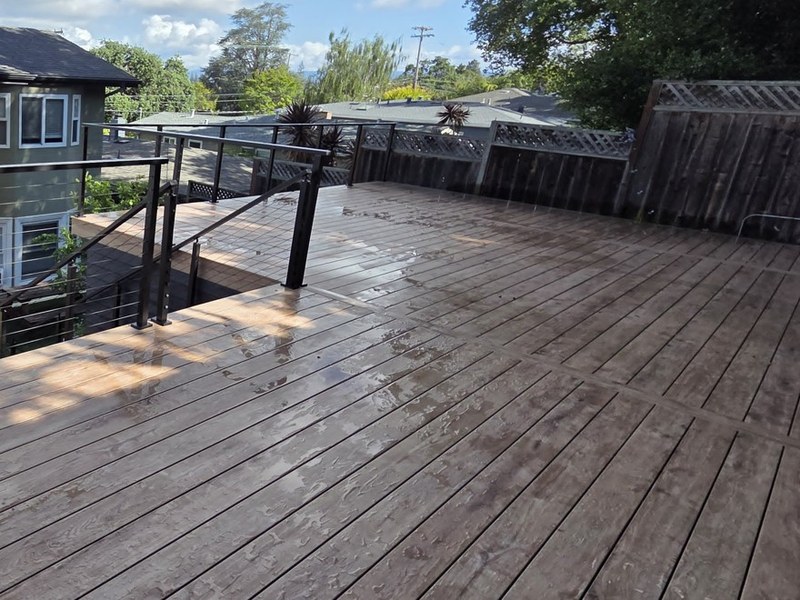 Eva-Last Pioneer deck in Barrel Oak with aluminum cable railing on a hillside, San Carlos
