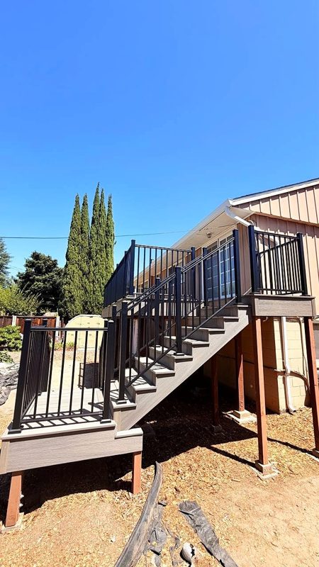 Black aluminum picket railing on the stairs