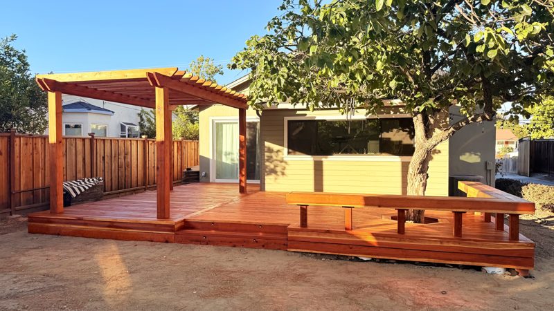 San Jose — Redwood deck around a tree with a bench and pergola